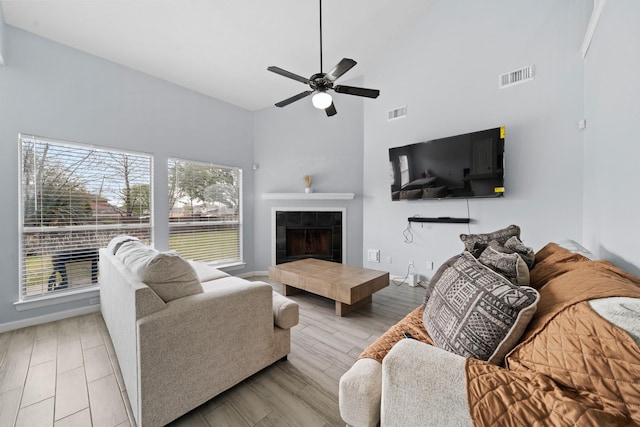 13619 Bonilla Ln, Houston, TX 77083 - living area featuring visible vents, wood finished floors, a ceiling fan, and plenty of natural light
