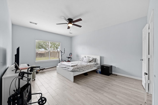 13619 Bonilla Ln, Houston, TX 77083 - bedroom featuring ceiling fan, baseboards, light wood finished floors, and visible vents