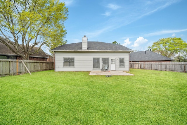 13619 Bonilla Ln, Houston, TX 77083 - rear view of property with a fenced backyard, a chimney, a patio area, and a yard