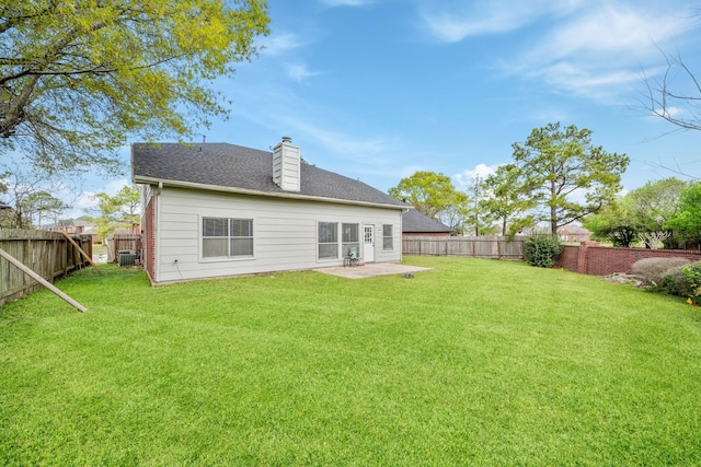 13619 Bonilla Ln, Houston, TX 77083 - back of property featuring a fenced backyard, a patio, and a lawn