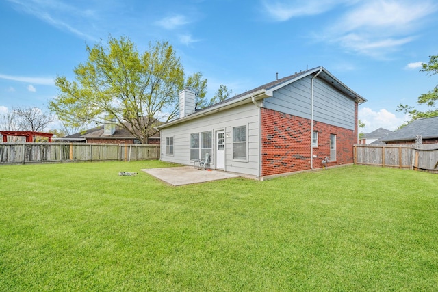 13619 Bonilla Ln, Houston, TX 77083 - rear view of house with a lawn, a fenced backyard, and a patio area