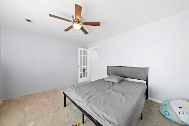 13619 Bonilla Ln, Houston, TX 77083 - bedroom with baseboards, visible vents, a ceiling fan, and light colored carpet