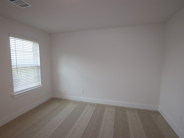 16208 Mcdonald County Ct, Montgomery, TX 77316 - empty room featuring light carpet and baseboards