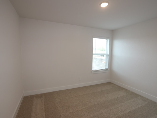 16208 Mcdonald County Ct, Montgomery, TX 77316 - spare room featuring light carpet and baseboards