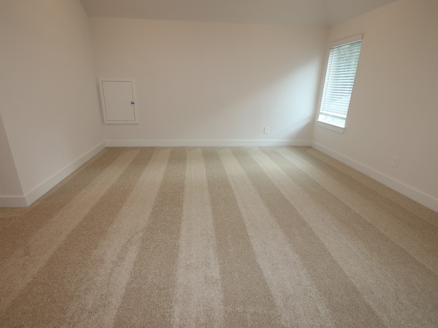 16208 Mcdonald County Ct, Montgomery, TX 77316 - empty room featuring light carpet and baseboards
