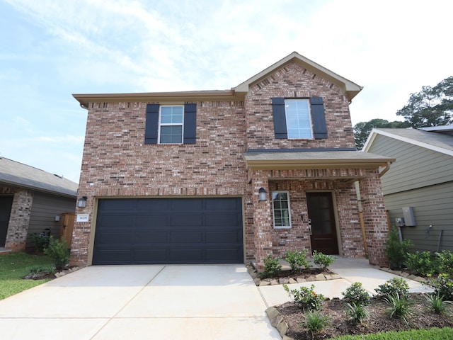 16208 Mcdonald County Ct, Montgomery, TX 77316 - traditional-style house featuring brick siding, an attached garage, and driveway