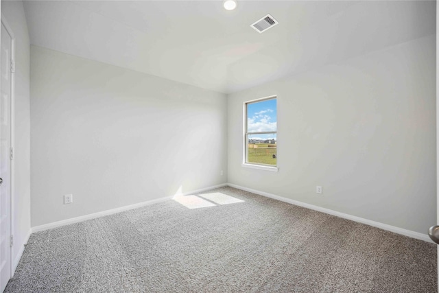 carpeted empty room with baseboards and visible vents