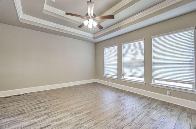 17473 Chestnut Cove Dr, Conroe, TX 77302 - unfurnished room with a raised ceiling, ornamental molding, wood finished floors, ceiling fan, and baseboards