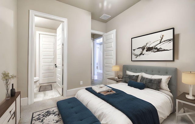 17473 Chestnut Cove Dr, Conroe, TX 77302 - bedroom with carpet floors, ensuite bathroom, and baseboards