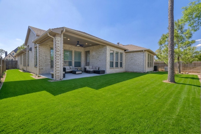 17473 Chestnut Cove Dr, Conroe, TX 77302 - rear view of house featuring outdoor lounge area, ceiling fan, brick siding, and a patio