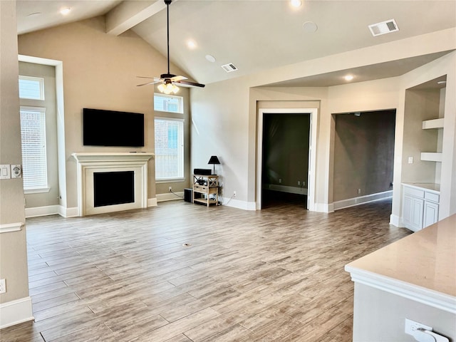 17473 Chestnut Cove Dr, Conroe, TX 77302 - living room featuring a fireplace, light wood-type flooring, a ceiling fan, and baseboards