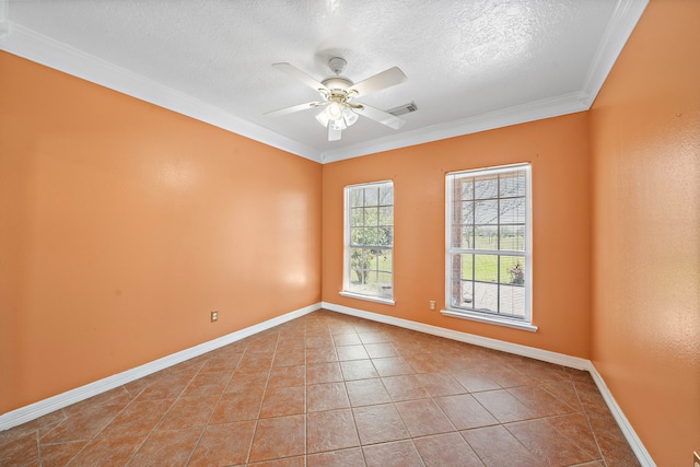 tiled spare room featuring crown molding, a ceiling fan, a textured ceiling, baseboards, and visible vents