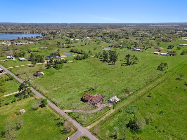 drone / aerial view with a water view and a rural view