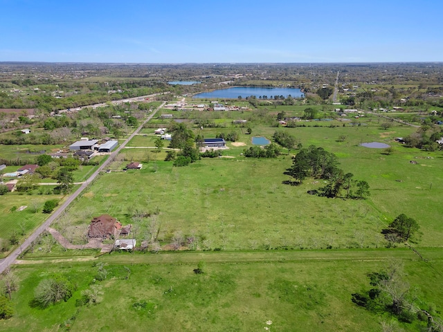 bird's eye view featuring a water view and a rural view