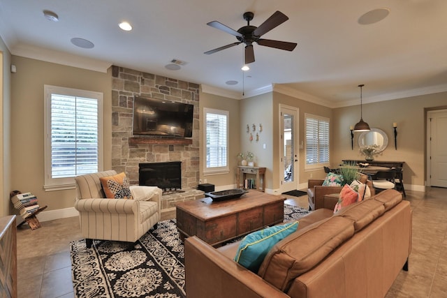 15614 Lake Iris Dr, Houston, TX 77070 - living area featuring a ceiling fan, a stone fireplace, ornamental molding, light tile patterned floors, and recessed lighting