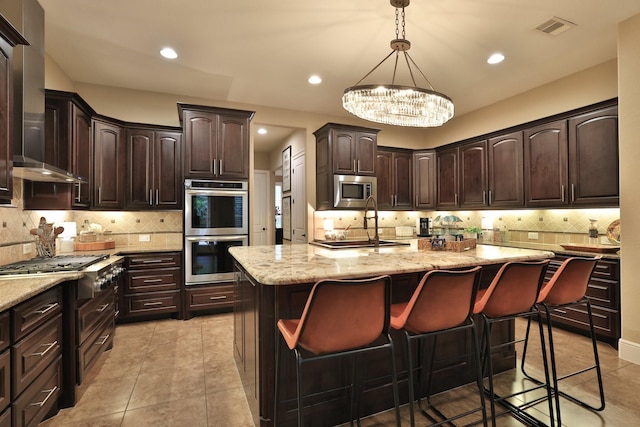 15614 Lake Iris Dr, Houston, TX 77070 - kitchen with appliances with stainless steel finishes, wall chimney exhaust hood, backsplash, a chandelier, and recessed lighting