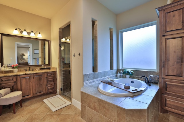 15614 Lake Iris Dr, Houston, TX 77070 - full bath with vanity, a bath, a shower stall, and tile patterned floors