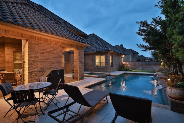 15614 Lake Iris Dr, Houston, TX 77070 - view of pool featuring a patio, a fenced backyard, and a pool with connected hot tub