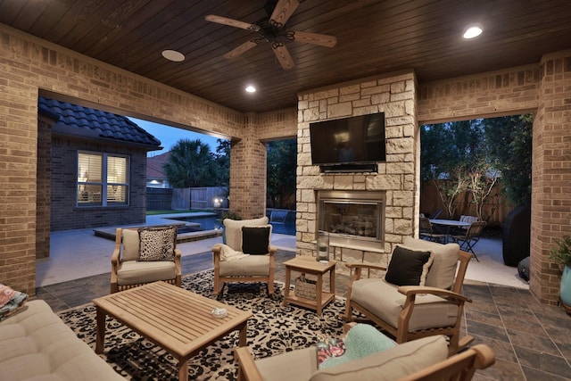 15614 Lake Iris Dr, Houston, TX 77070 - fenced backyard featuring an outdoor living space with a fireplace, a patio area, and ceiling fan