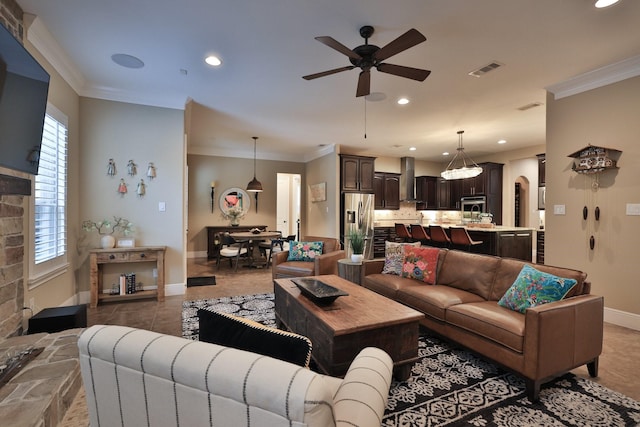 15614 Lake Iris Dr, Houston, TX 77070 - living room with ceiling fan, ornamental molding, recessed lighting, tile patterned flooring, and arched walkways