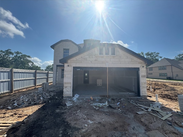 garage with fence
