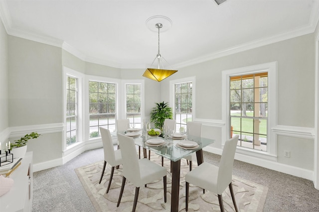 14 Wind River Dr, Conroe, TX 77384 - dining space with light colored carpet, healthy amount of natural light, and ornamental molding