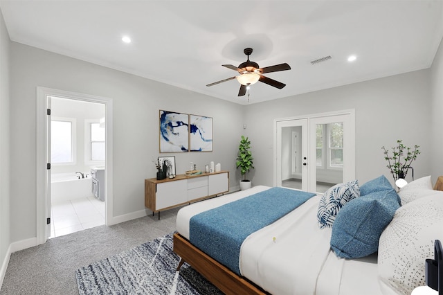 14 Wind River Dr, Conroe, TX 77384 - bedroom with french doors, light carpet, multiple windows, baseboards, and recessed lighting