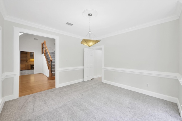 14 Wind River Dr, Conroe, TX 77384 - carpeted spare room featuring ornamental molding, stairs, and baseboards