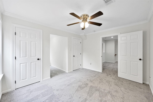 14 Wind River Dr, Conroe, TX 77384 - unfurnished bedroom featuring carpet flooring, crown molding, baseboards, and a ceiling fan