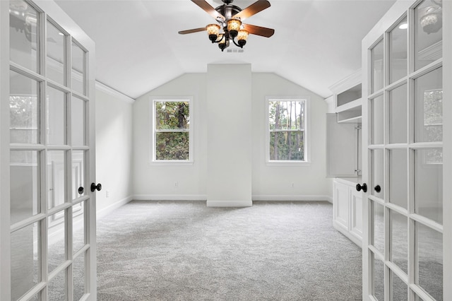 14 Wind River Dr, Conroe, TX 77384 - additional living space featuring french doors, carpet, ceiling fan, vaulted ceiling, and baseboards