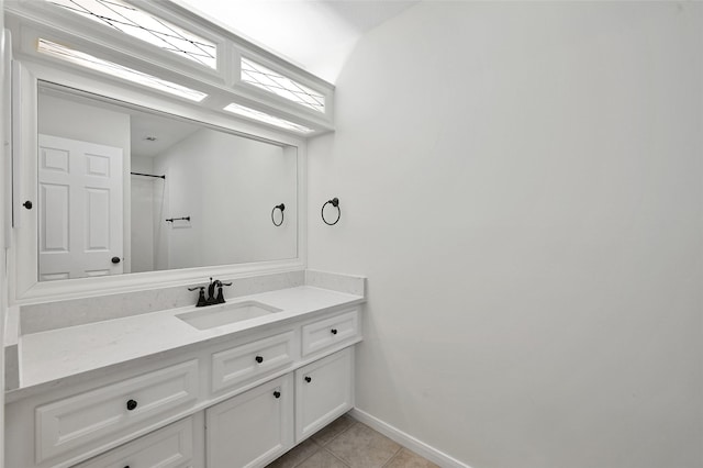 14 Wind River Dr, Conroe, TX 77384 - bathroom with tile patterned flooring, vanity, and baseboards