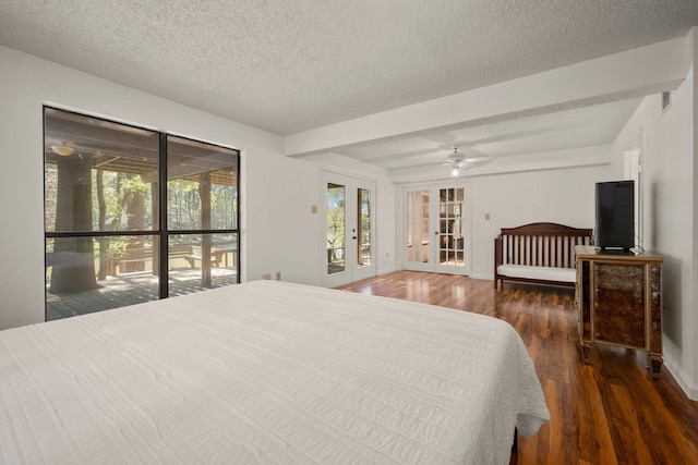 bedroom featuring french doors, baseboards, a textured ceiling, access to exterior, and wood finished floors