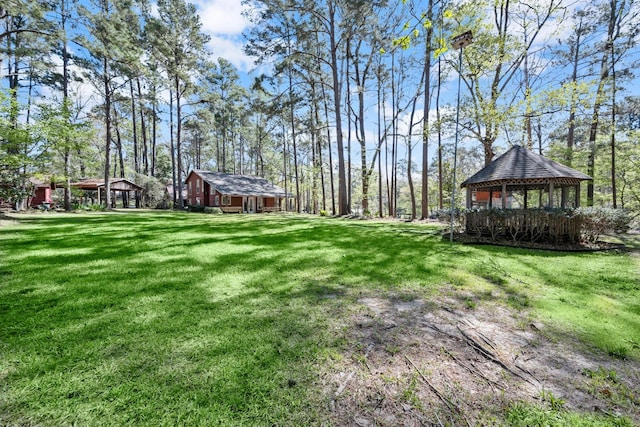 view of yard with an outdoor structure and a gazebo