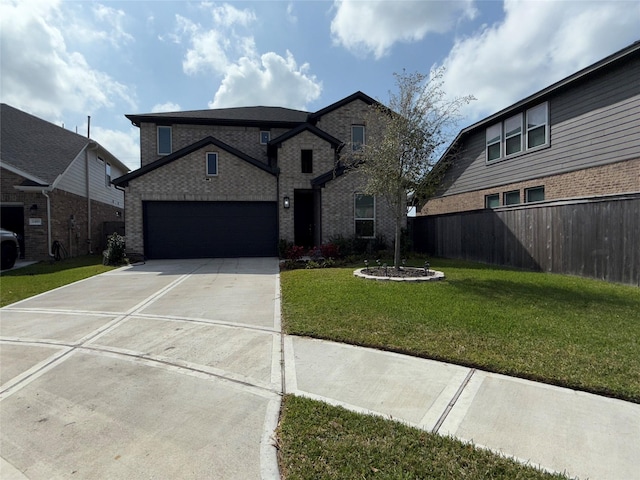 2412 Elliott Shore Ln, La Porte, TX 77571 - view of front of house with concrete driveway, fence, an attached garage, a front yard, and brick siding