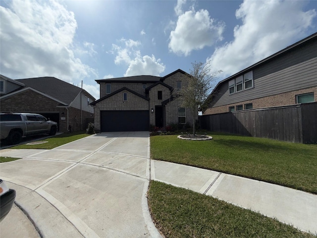 2412 Elliott Shore Ln, La Porte, TX 77571 - view of front facade featuring fence, a garage, brick siding, a front lawn, and driveway
