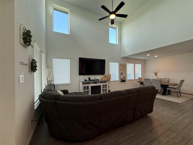 2412 Elliott Shore Ln, La Porte, TX 77571 - living room featuring dark wood finished floors, a wealth of natural light, ceiling fan, and baseboards