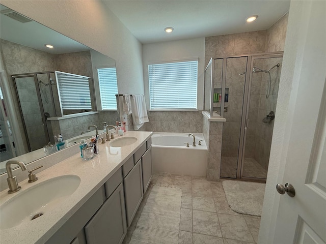 2412 Elliott Shore Ln, La Porte, TX 77571 - full bathroom featuring a sink, a stall shower, and a bath