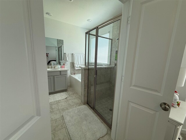 2412 Elliott Shore Ln, La Porte, TX 77571 - bathroom with a stall shower, vanity, and a garden tub
