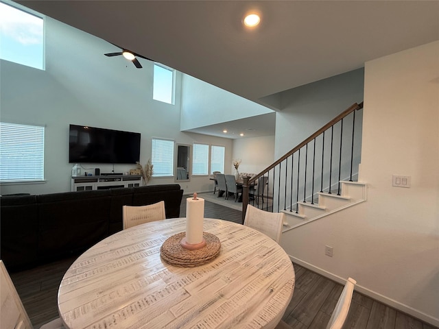 2412 Elliott Shore Ln, La Porte, TX 77571 - dining space with baseboards, stairs, ceiling fan, and wood finished floors