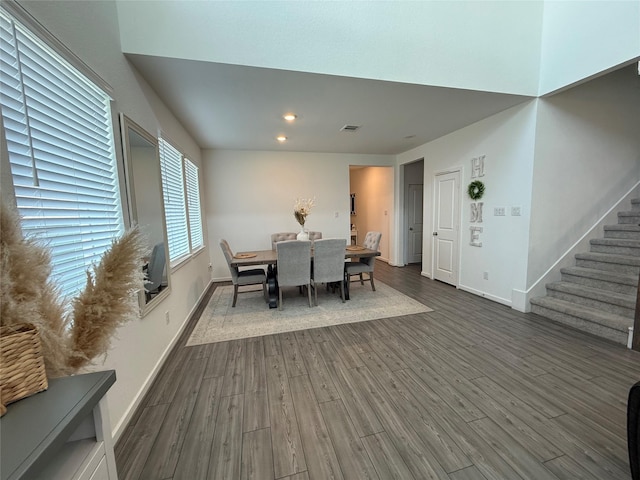 2412 Elliott Shore Ln, La Porte, TX 77571 - dining space featuring stairway, dark wood-style floors, baseboards, visible vents, and recessed lighting