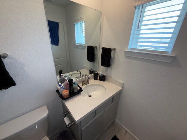 2412 Elliott Shore Ln, La Porte, TX 77571 - half bath featuring baseboards, toilet, and vanity
