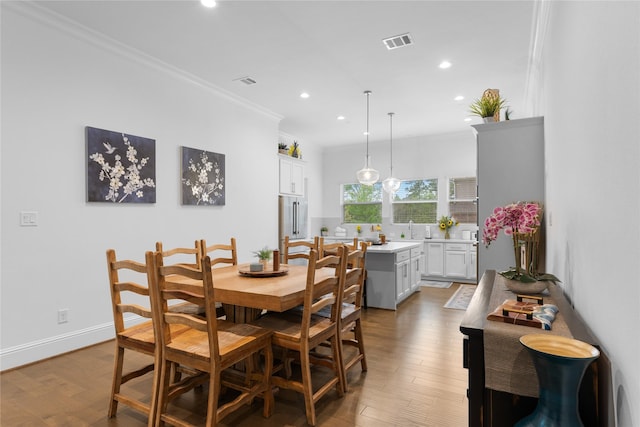 106 Golden Eye Ct, Montgomery, TX 77316 - dining space with crown molding, recessed lighting, and light wood-style flooring
