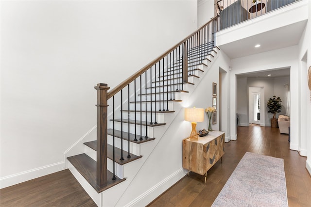 106 Golden Eye Ct, Montgomery, TX 77316 - stairs with wood finished floors, baseboards, recessed lighting, and a towering ceiling