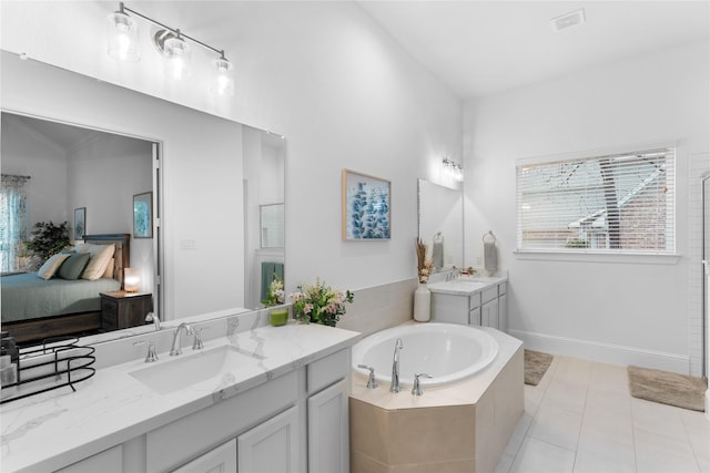 106 Golden Eye Ct, Montgomery, TX 77316 - full bath with ensuite bath, plenty of natural light, a bath, and tile patterned flooring