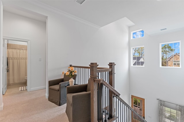 106 Golden Eye Ct, Montgomery, TX 77316 - hall featuring an upstairs landing, a towering ceiling, carpet flooring, ornamental molding, and baseboards