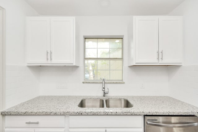 1501 Maiden Ln, Richmond, TX 77469 - kitchen featuring white cabinets, a sink, stainless steel dishwasher, and light stone countertops