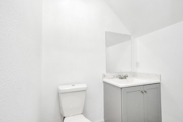 1501 Maiden Ln, Richmond, TX 77469 - half bath with toilet, vanity, and vaulted ceiling