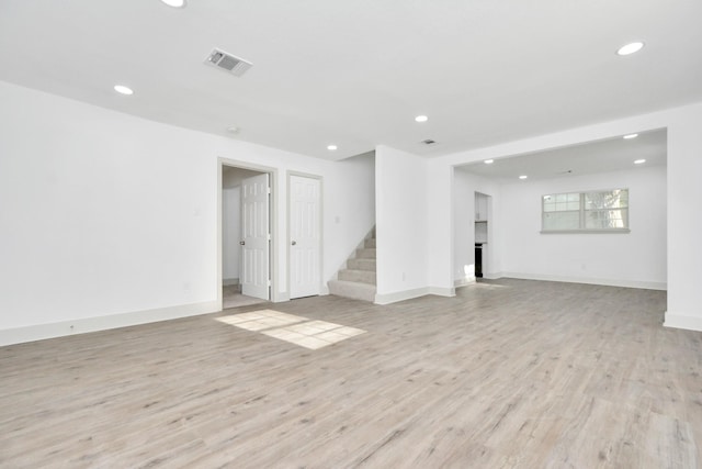 1501 Maiden Ln, Richmond, TX 77469 - interior space with stairs, a fireplace, visible vents, light wood-style floors, and recessed lighting
