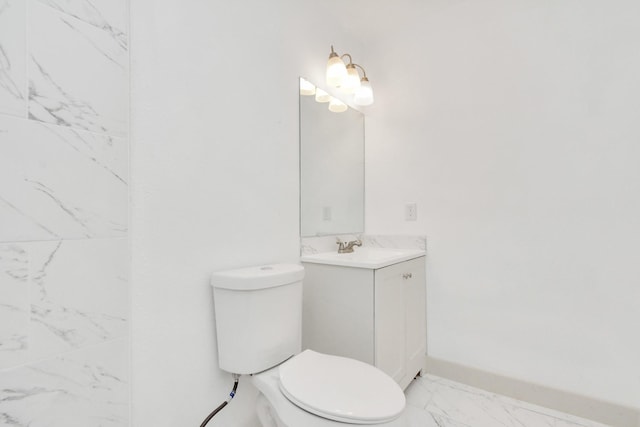 1501 Maiden Ln, Richmond, TX 77469 - bathroom featuring marble finish floor, vanity, toilet, and baseboards