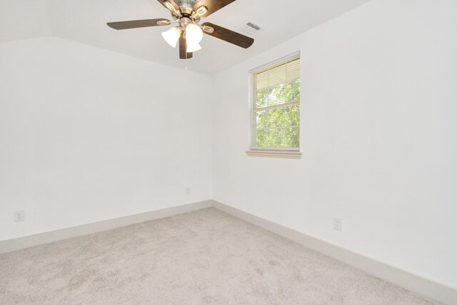 1501 Maiden Ln, Richmond, TX 77469 - unfurnished room featuring lofted ceiling, baseboards, visible vents, a ceiling fan, and light carpet